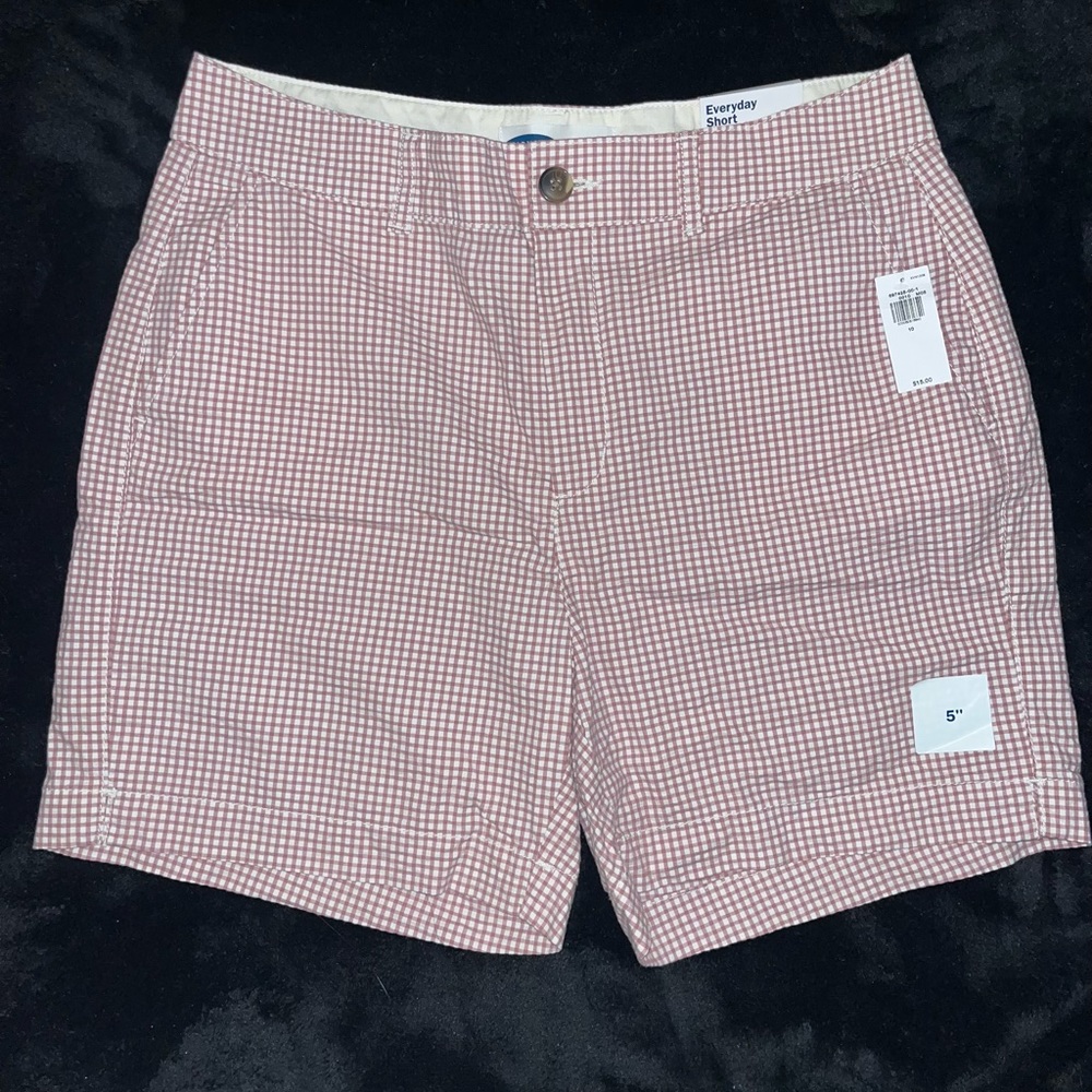 Cute pink and white checked pattern. Brand new, never worn with rage still on.